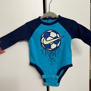 Blue Nike long sleeve soccer onesie.